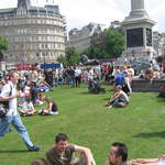 People enjoying Trafalar Sq. Green