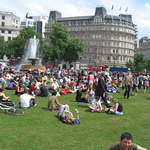 People enjoying Trafalar Sq. Green