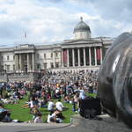 People enjoying Trafalar Sq. Green