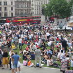 People enjoying Trafalar Sq. Green