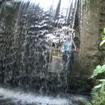 Alison behind the waterfall