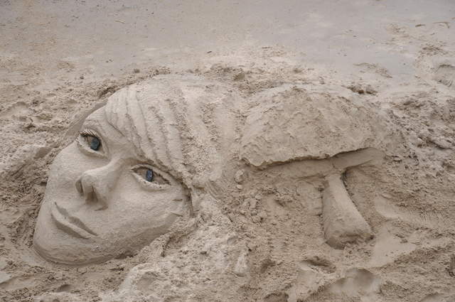 Faces in the sand