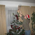 Ali putting the star on the tree