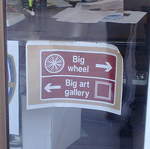 Helpful tourist signs along South Bank to the Big Wheel and Big Art Gallery