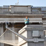 Marion knitting on the plinth