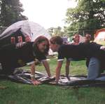Jen and Alison putting away the tent...