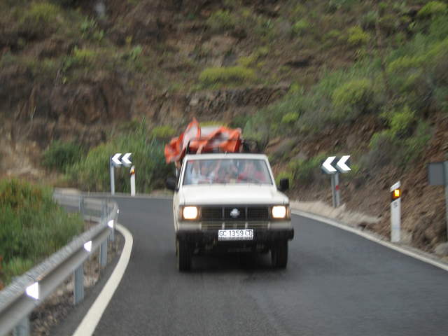 The jeep behind, with a rain sheet!