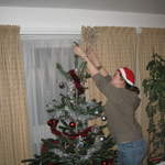 Ali putting the star on the tree