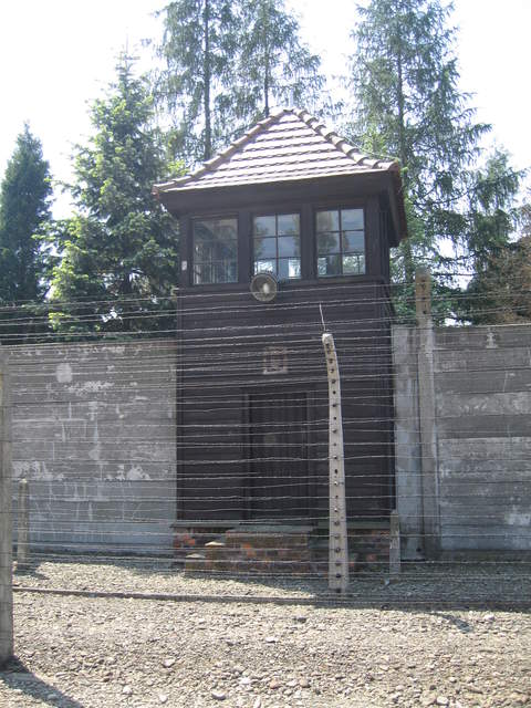 Electrified fence and guard tower at Auschwitz