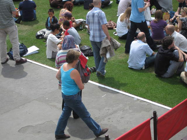 People enjoying Trafalar Sq. Green