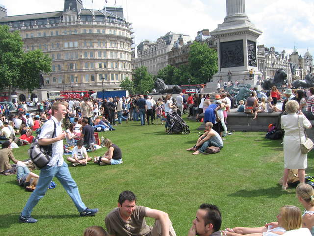 People enjoying Trafalar Sq. Green