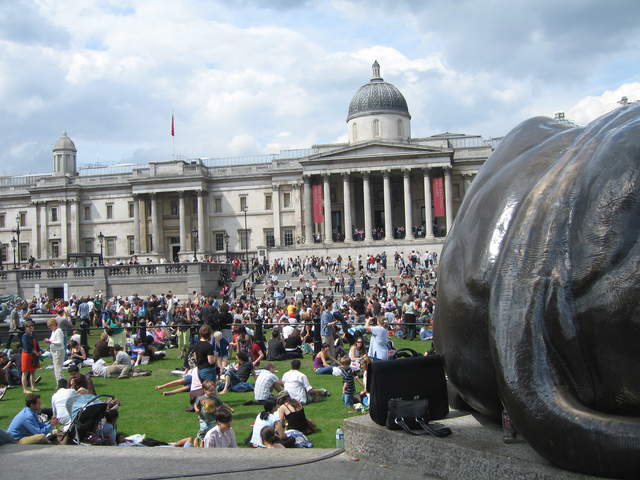 People enjoying Trafalar Sq. Green