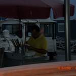 Man putting my dinner on a stick