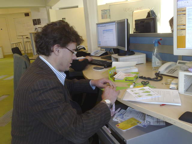 Alastair making a paper christmas tree