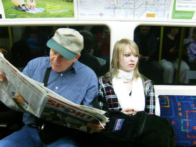 Jim reading and Catherine, on the tube