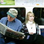 Jim reading and Catherine, on the tube