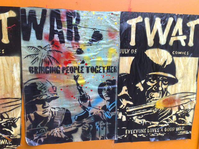 Satirical War Comic posters, outside the Tate Modern