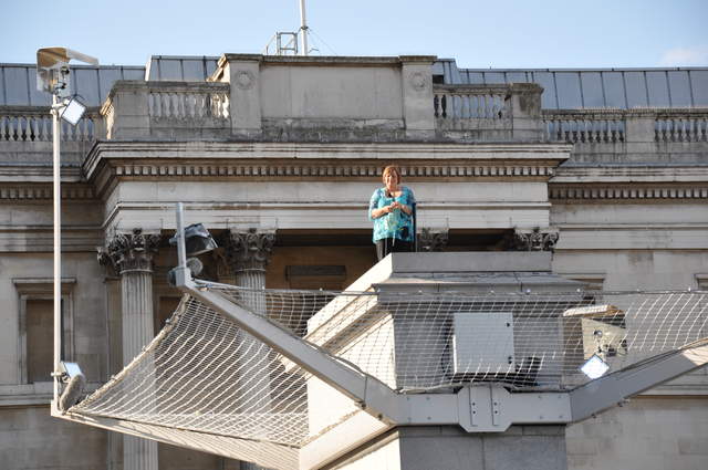 Marion knitting on the plinth
